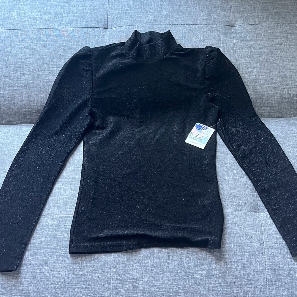 sparkly turtleneck with puff sleeves